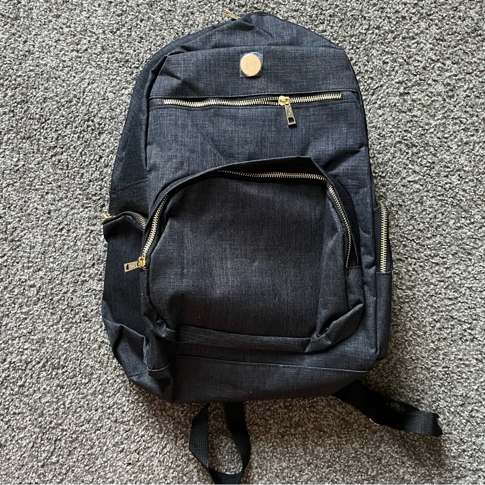 Jessica Moore dark grey and gold travel backpack